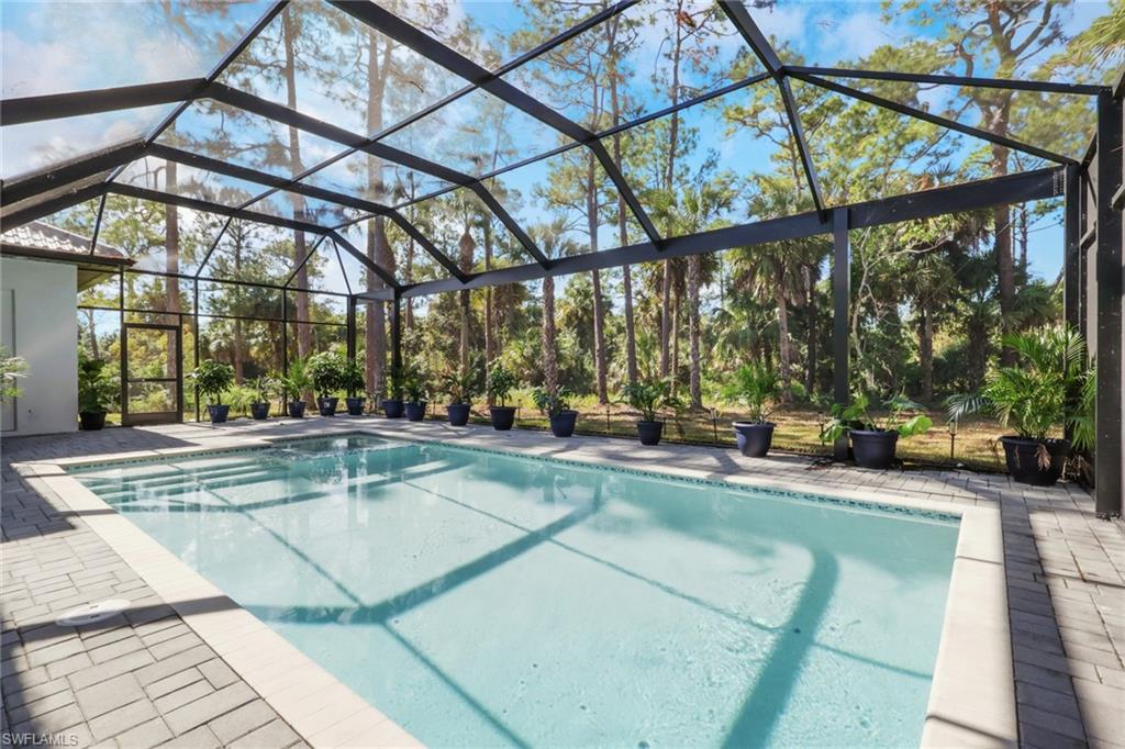 491 9th Street Southwest Naples, FL 34117 - Photo 30 of 49 a view of a swimming pool with a patio