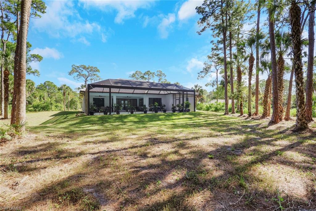 491 9th Street Southwest Naples, FL 34117 - Photo 31 of 49 a view of a house with a big yard