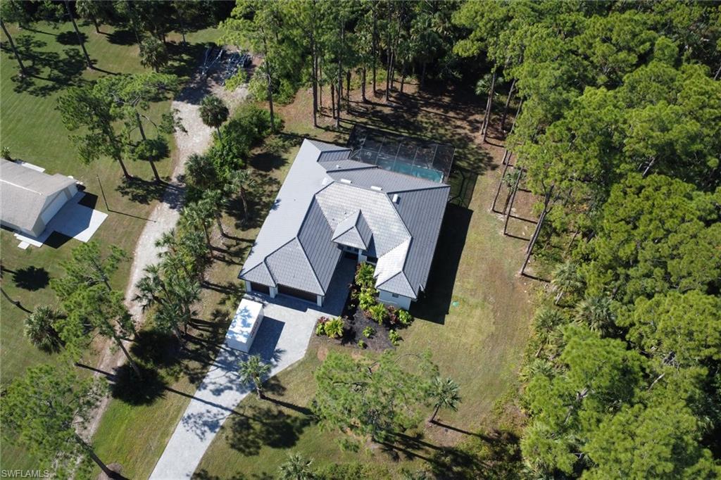 491 9th Street Southwest Naples, FL 34117 - Photo 44 of 49 an aerial view of a house with garden space and street view