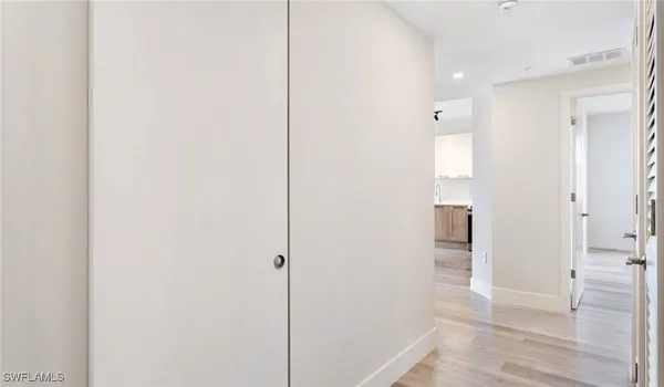 an empty room with wooden floor