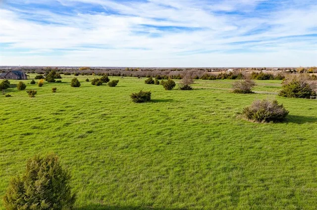 a view of a field with an outdoor space