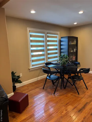 a work room with furniture and wooden floor