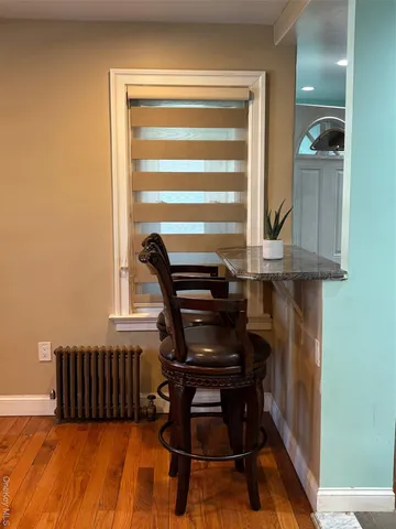 a view of balcony with furniture and a window