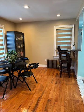 a workspace room with furniture and wooden floor