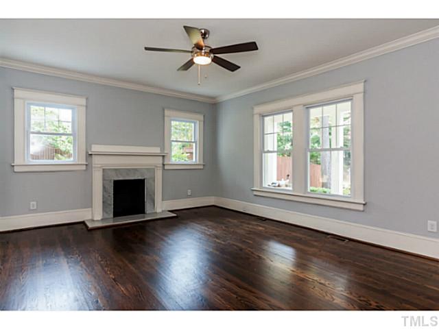 1600 St Marys Street Raleigh, NC 27608 - Photo 8 of 24 a view of empty room with wooden floor and fan