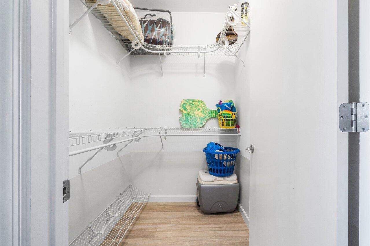 2640 Lake Shore Drive, Unit 711 Riviera Beach, FL 33404 - Photo 36 of 59 walk in closet in bedroom #2