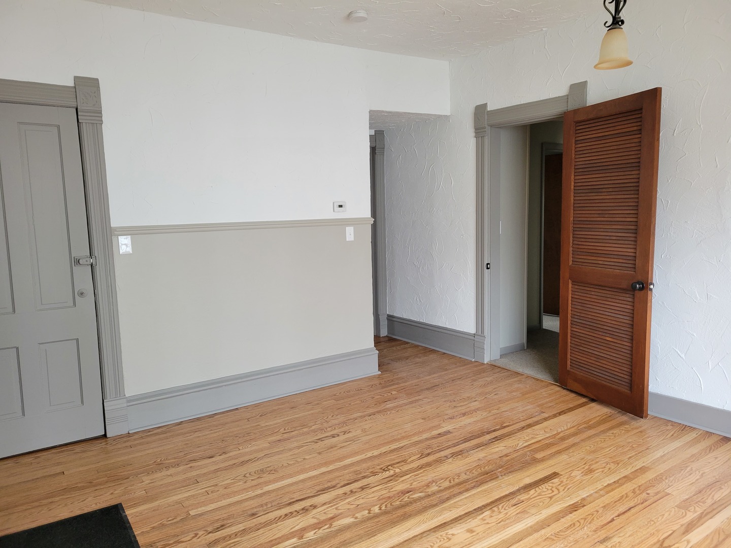 986 Main Street Antioch, IL 60002 - Photo 12 of 24 an empty room with wooden floor and closet