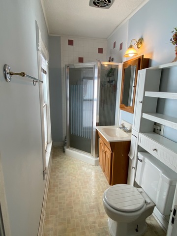 986 Main Street Antioch, IL 60002 - Photo 21 of 24 a bathroom with a sink a toilet and shower