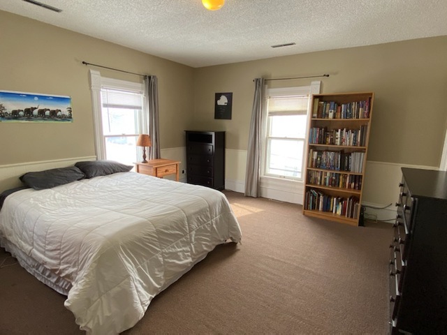 986 Main Street Antioch, IL 60002 - Photo 22 of 24 a spacious bedroom with a bed and a window