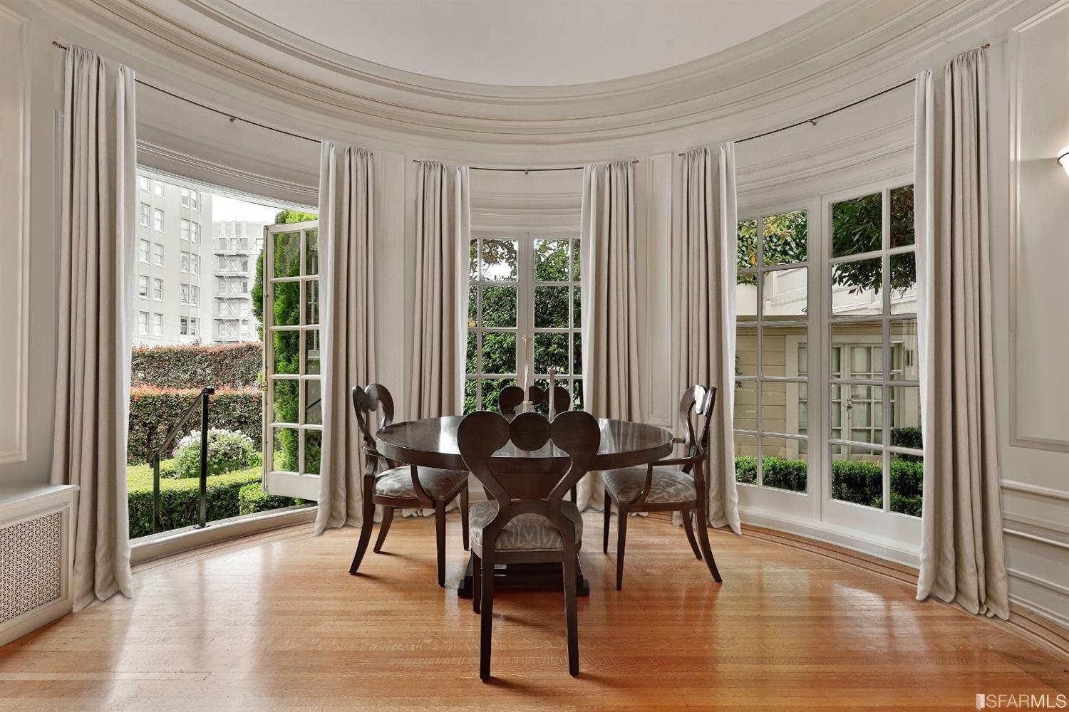 1925 Gough Street, Unit 11 San Francisco, CA 94109 - Photo 13 of 46 a view of a dining room with furniture and wooden floor