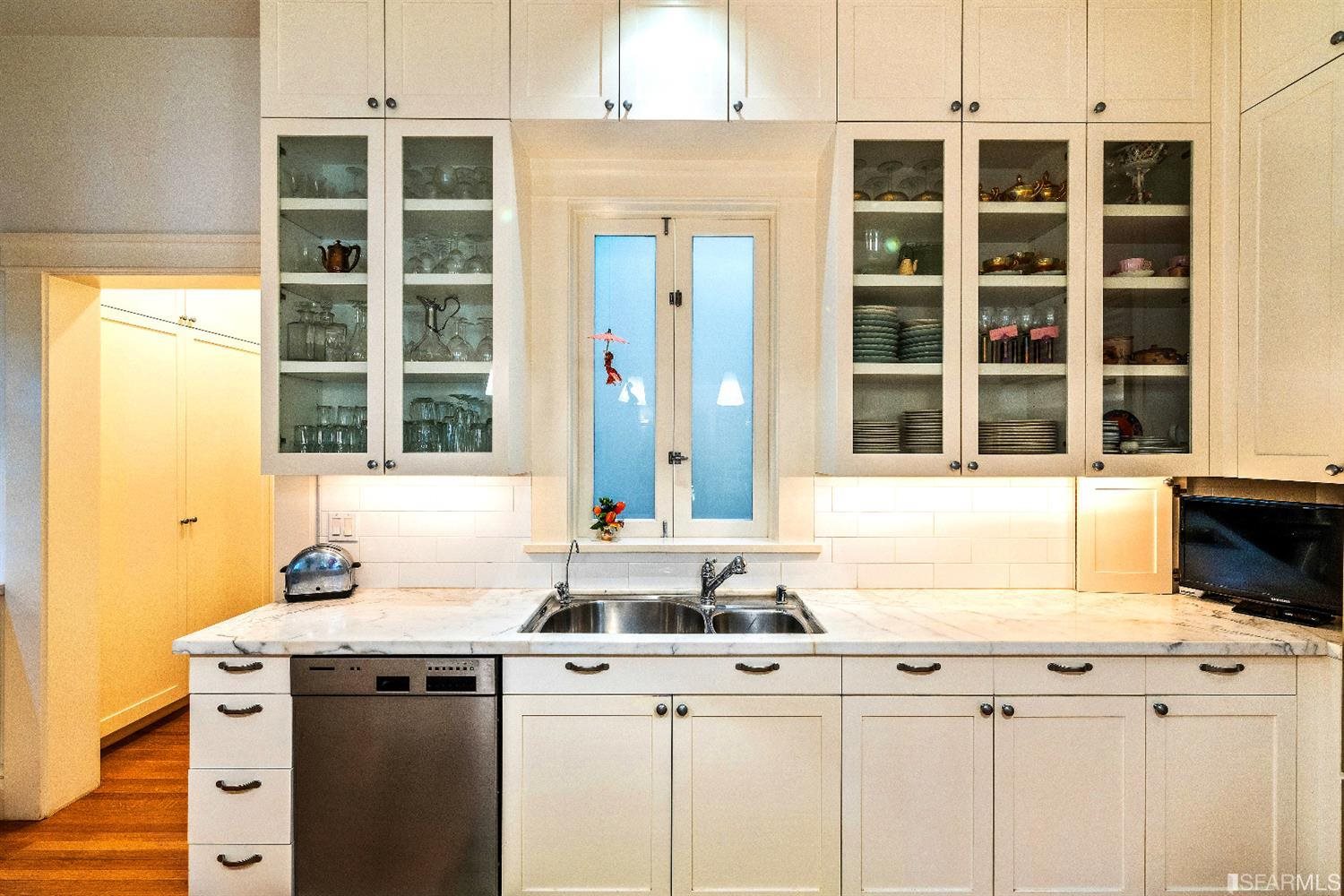 1925 Gough Street, Unit 11 San Francisco, CA 94109 - Photo 17 of 46 a kitchen with a sink and a window