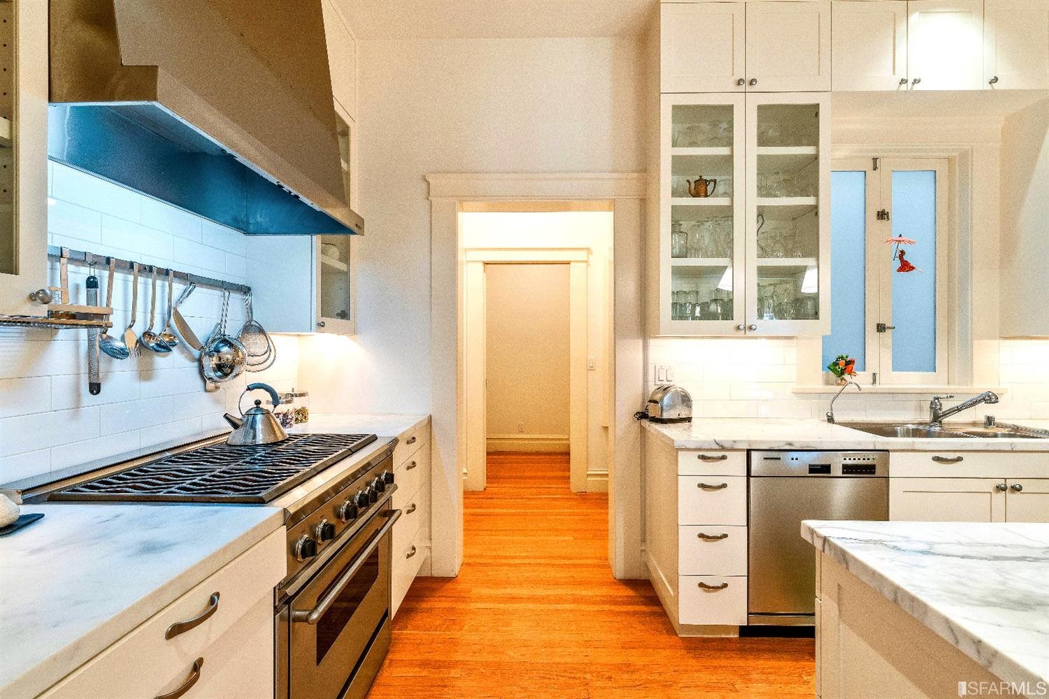 1925 Gough Street, Unit 11 San Francisco, CA 94109 - Photo 19 of 46 a kitchen with a stove and a sink