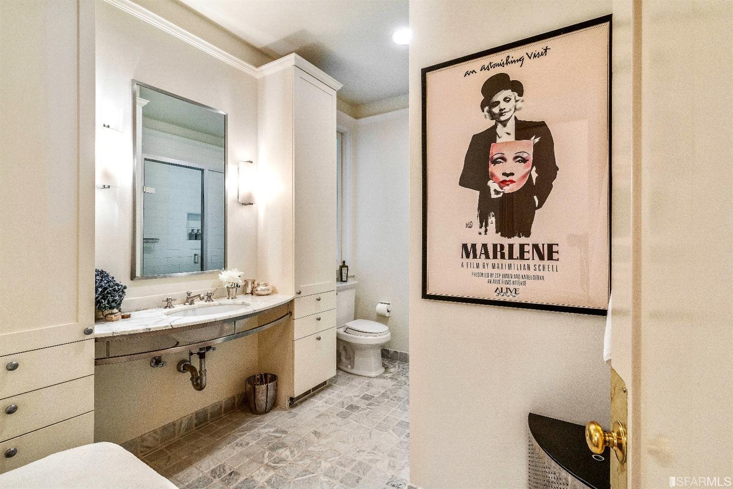 1925 Gough Street, Unit 11 San Francisco, CA 94109 - Photo 21 of 46 a bathroom with a toilet sink and mirror