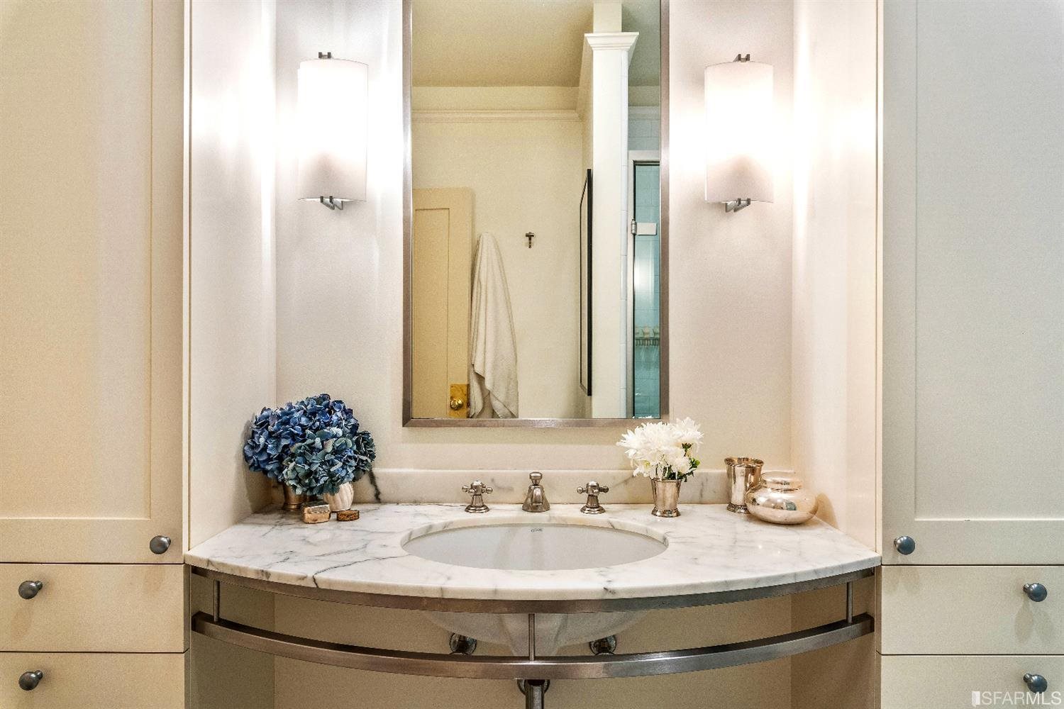 1925 Gough Street, Unit 11 San Francisco, CA 94109 - Photo 22 of 46 a bathroom with a granite countertop sink and a mirror