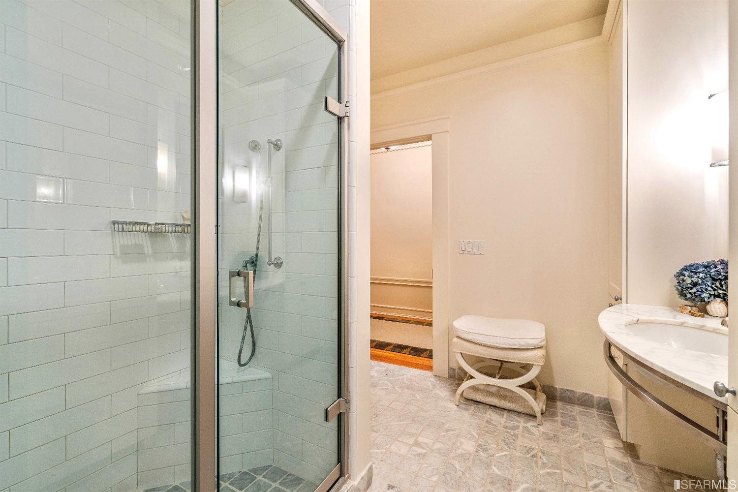 1925 Gough Street, Unit 11 San Francisco, CA 94109 - Photo 25 of 46 a bathroom with a toilet a sink and shower