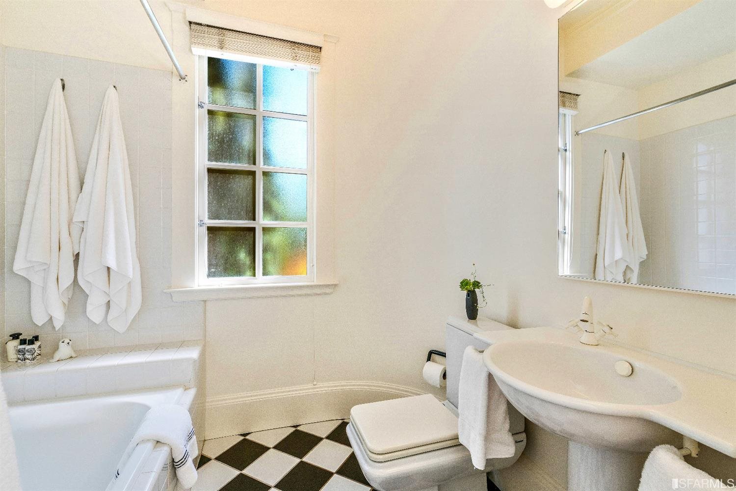 1925 Gough Street, Unit 11 San Francisco, CA 94109 - Photo 28 of 46 a bathroom with a sink toilet and shower