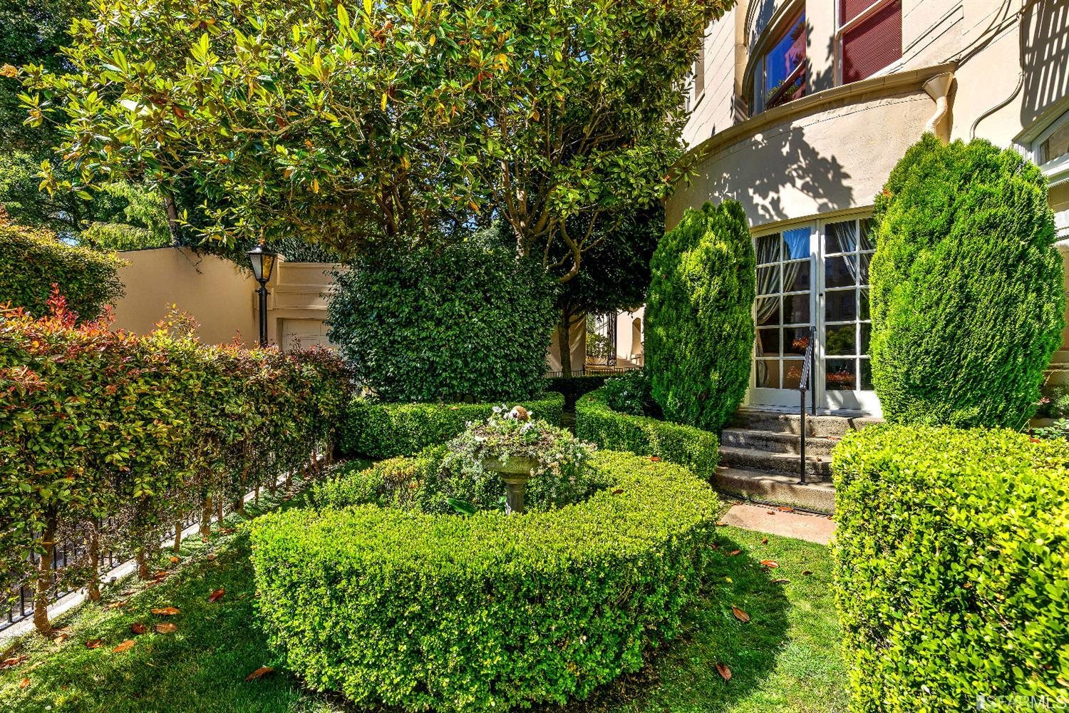 1925 Gough Street, Unit 11 San Francisco, CA 94109 - Photo 31 of 46 a view of a house with a yard and plants