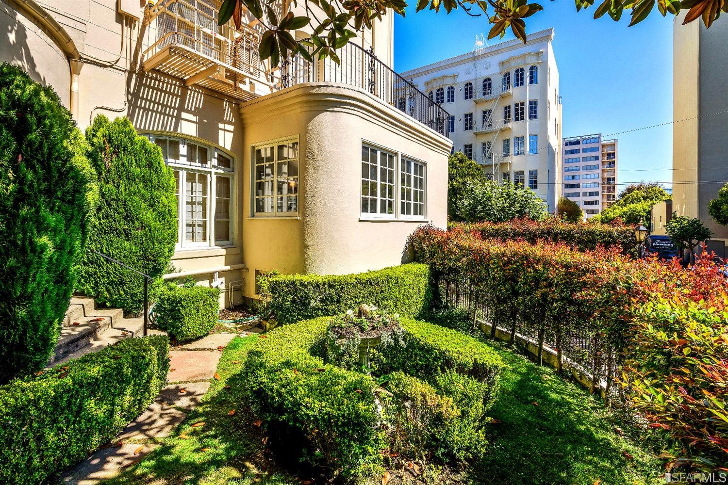 1925 Gough Street, Unit 11 San Francisco, CA 94109 - Photo 32 of 46 a front view of a residential houses with yard and green space