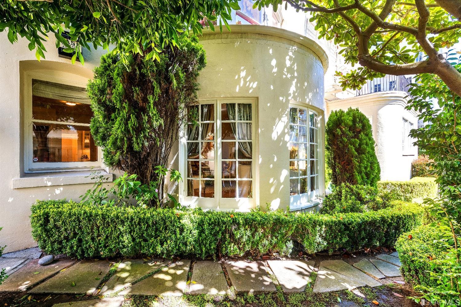 1925 Gough Street, Unit 11 San Francisco, CA 94109 - Photo 33 of 46 a front view of a house with a yard