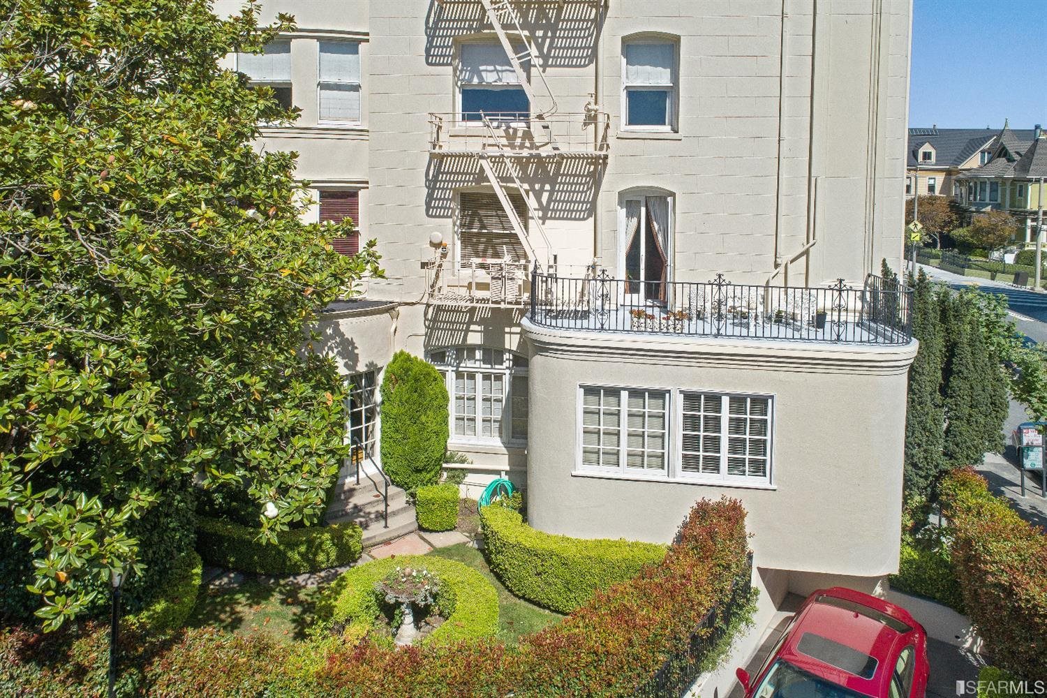 1925 Gough Street, Unit 11 San Francisco, CA 94109 - Photo 40 of 46 a balcony with table and chairs