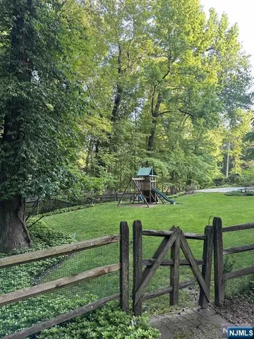 a view of a swimming pool with a yard