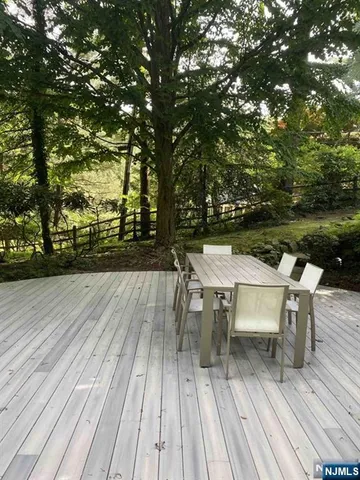 a view of a patio with table and chairs and potted plants