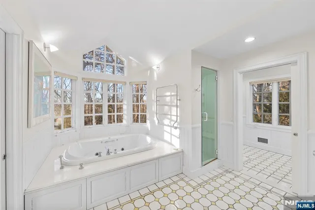 a bathroom with a bathtub and a sink