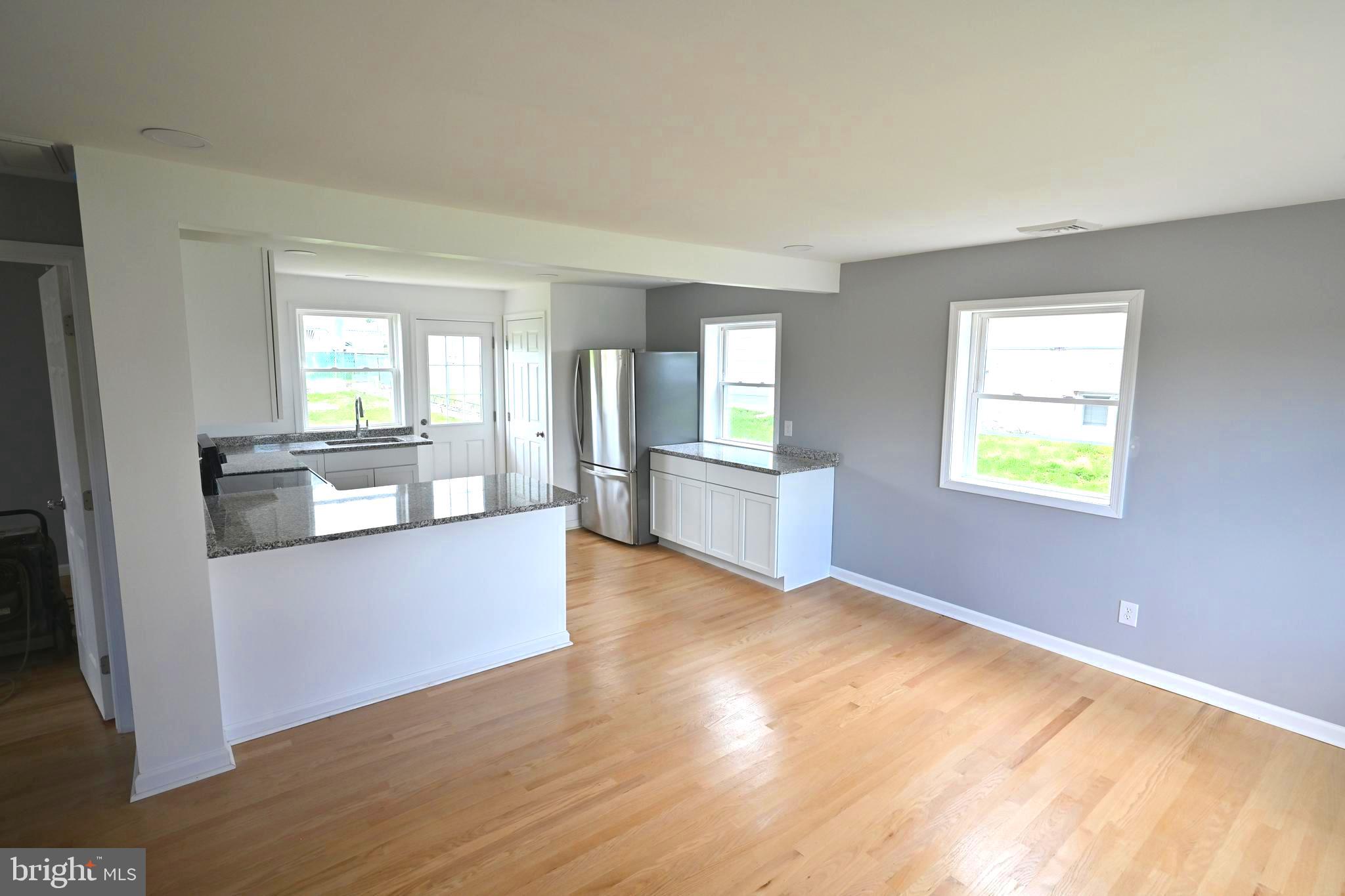 34 Compass Road East Middle River, MD 21220 - Photo 7 of 25 a view of kitchen and hall with wooden floor