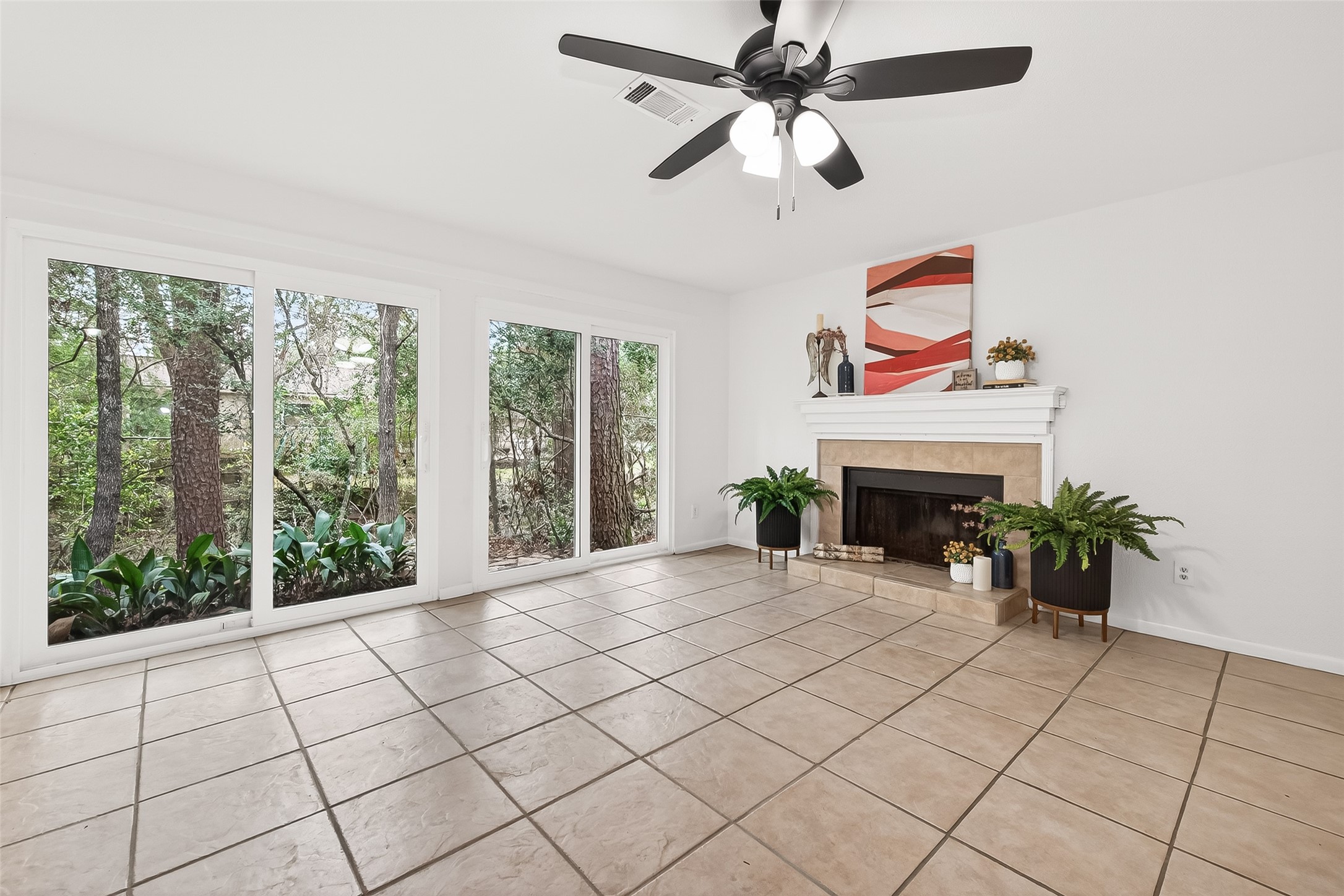 1 Laurel Oak Place Spring, TX 77380 - Photo 12 of 39 an empty room with windows and fireplace