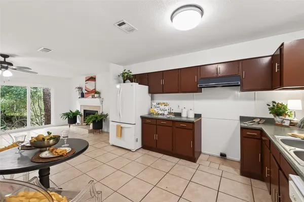 a kitchen with stainless steel appliances granite countertop a sink and a stove