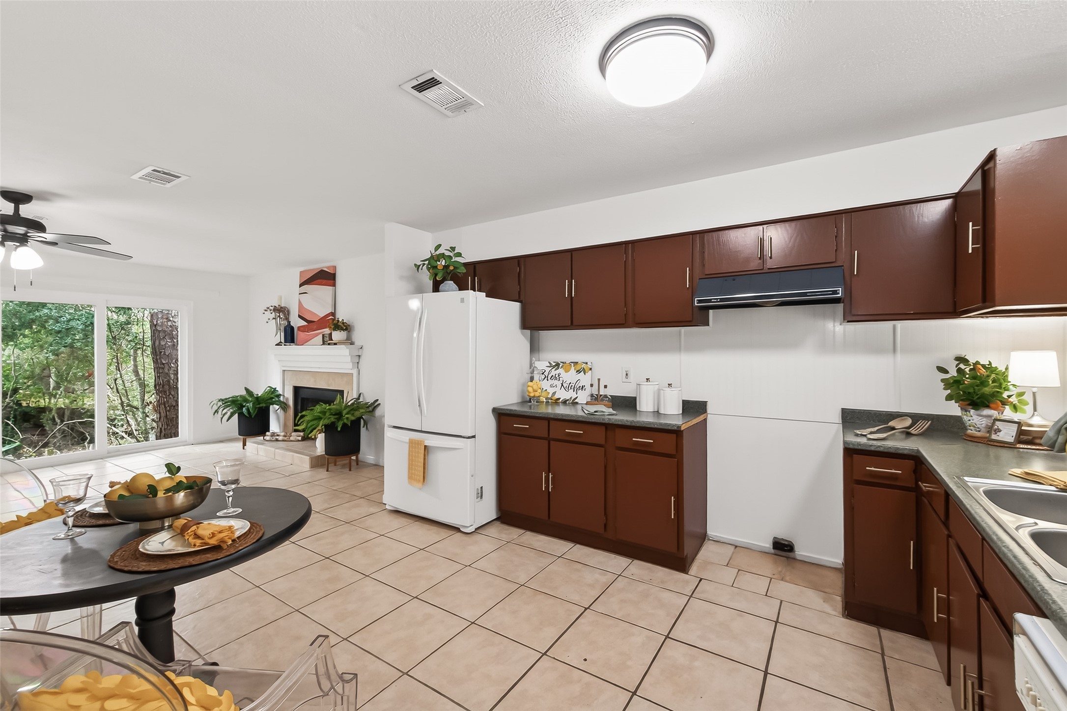 1 Laurel Oak Place Spring, TX 77380 - Photo 18 of 39 a kitchen with stainless steel appliances kitchen island granite countertop a sink and cabinets