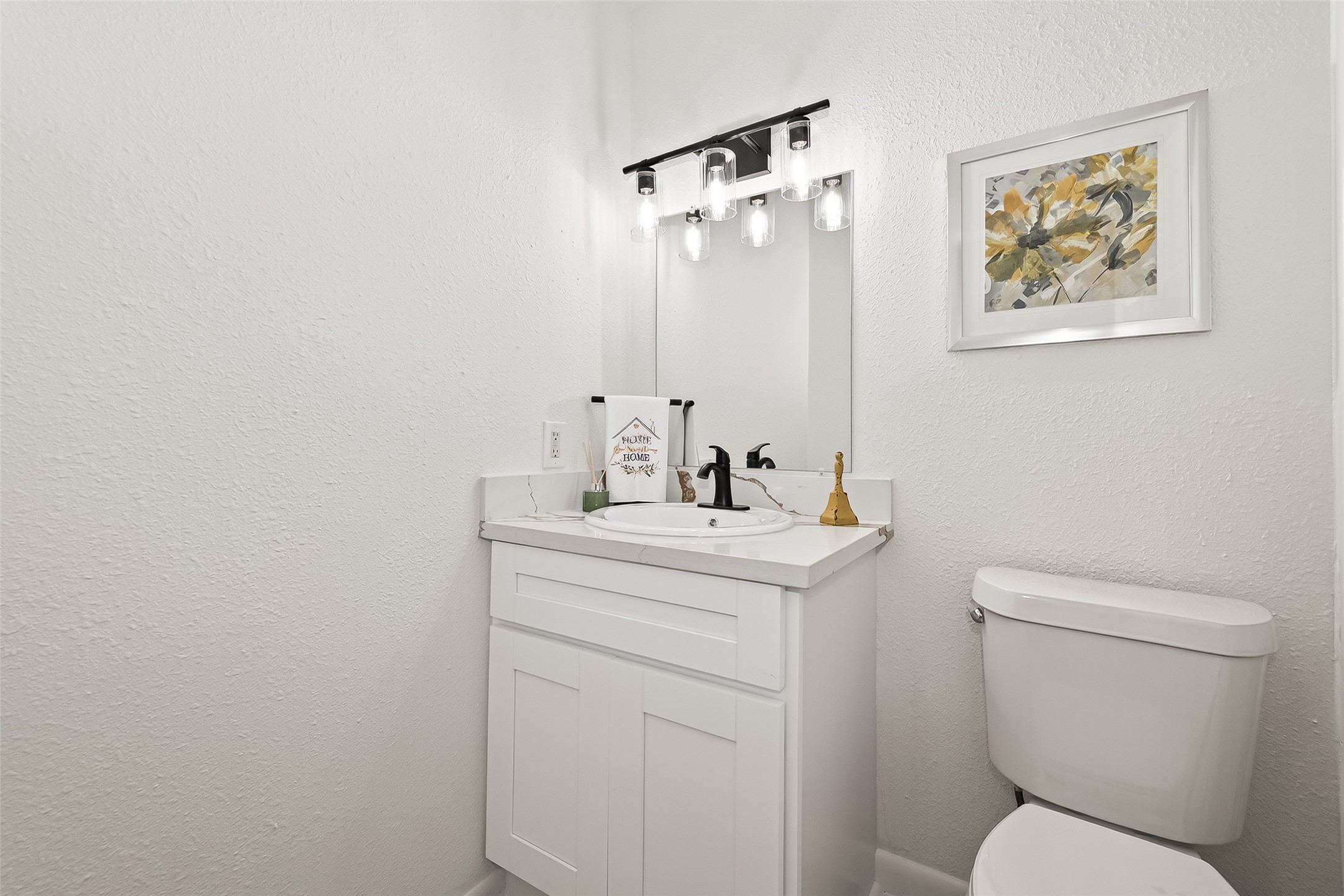 1 Laurel Oak Place Spring, TX 77380 - Photo 22 of 39 a bathroom with a toilet sink and mirror