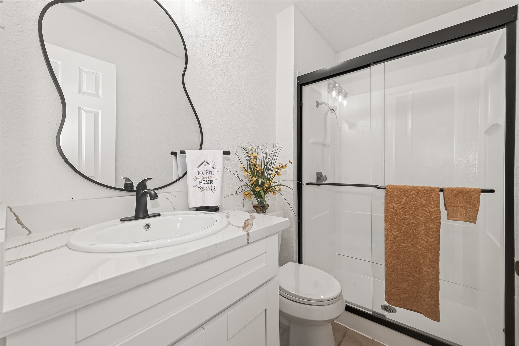 1 Laurel Oak Place Spring, TX 77380 - Photo 33 of 39 a bathroom with a sink toilet and shower