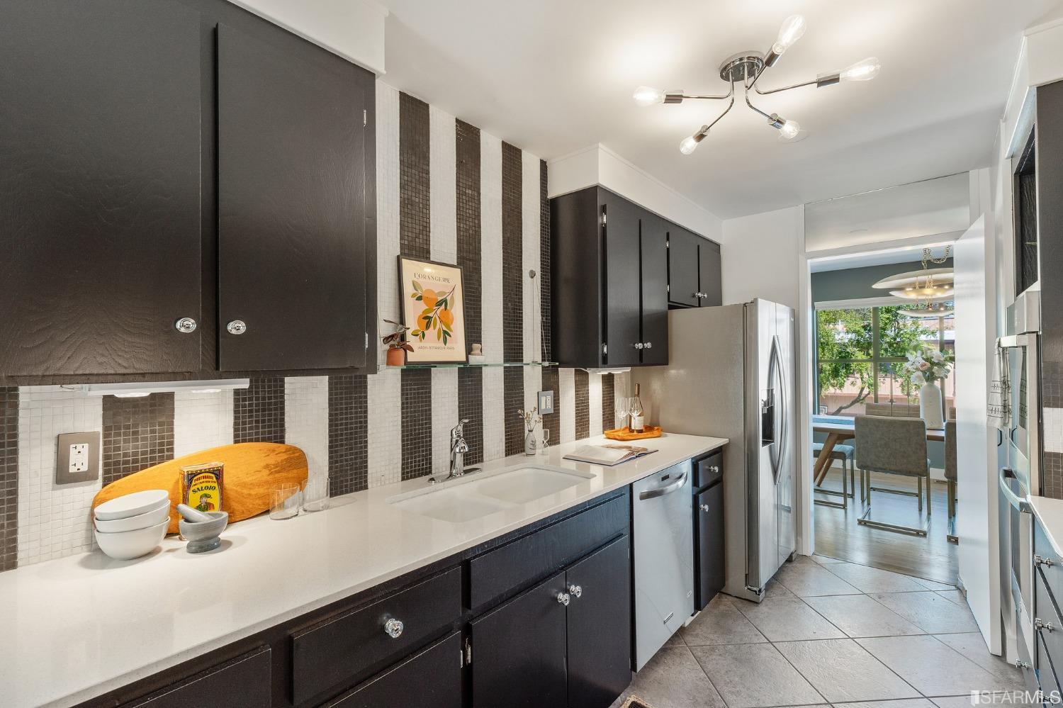 47 Malta Drive San Francisco, CA 94131 - Photo 11 of 40 a kitchen with stainless steel appliances kitchen island granite countertop a refrigerator and a sink