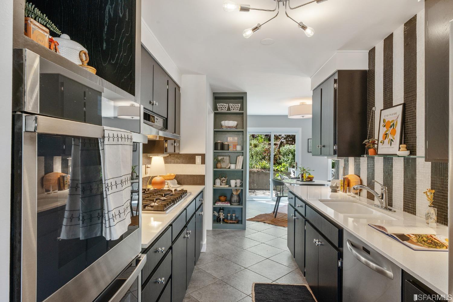 47 Malta Drive San Francisco, CA 94131 - Photo 12 of 40 a kitchen with stainless steel appliances a stove and a refrigerator