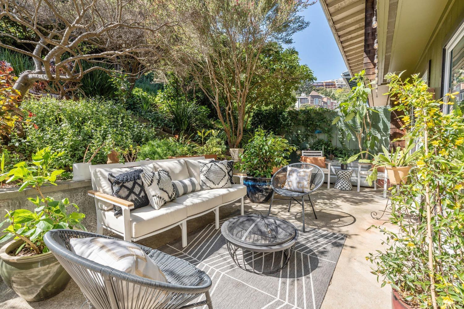 47 Malta Drive San Francisco, CA 94131 - Photo 17 of 40 a view of a patio with couches table and chairs and potted plants