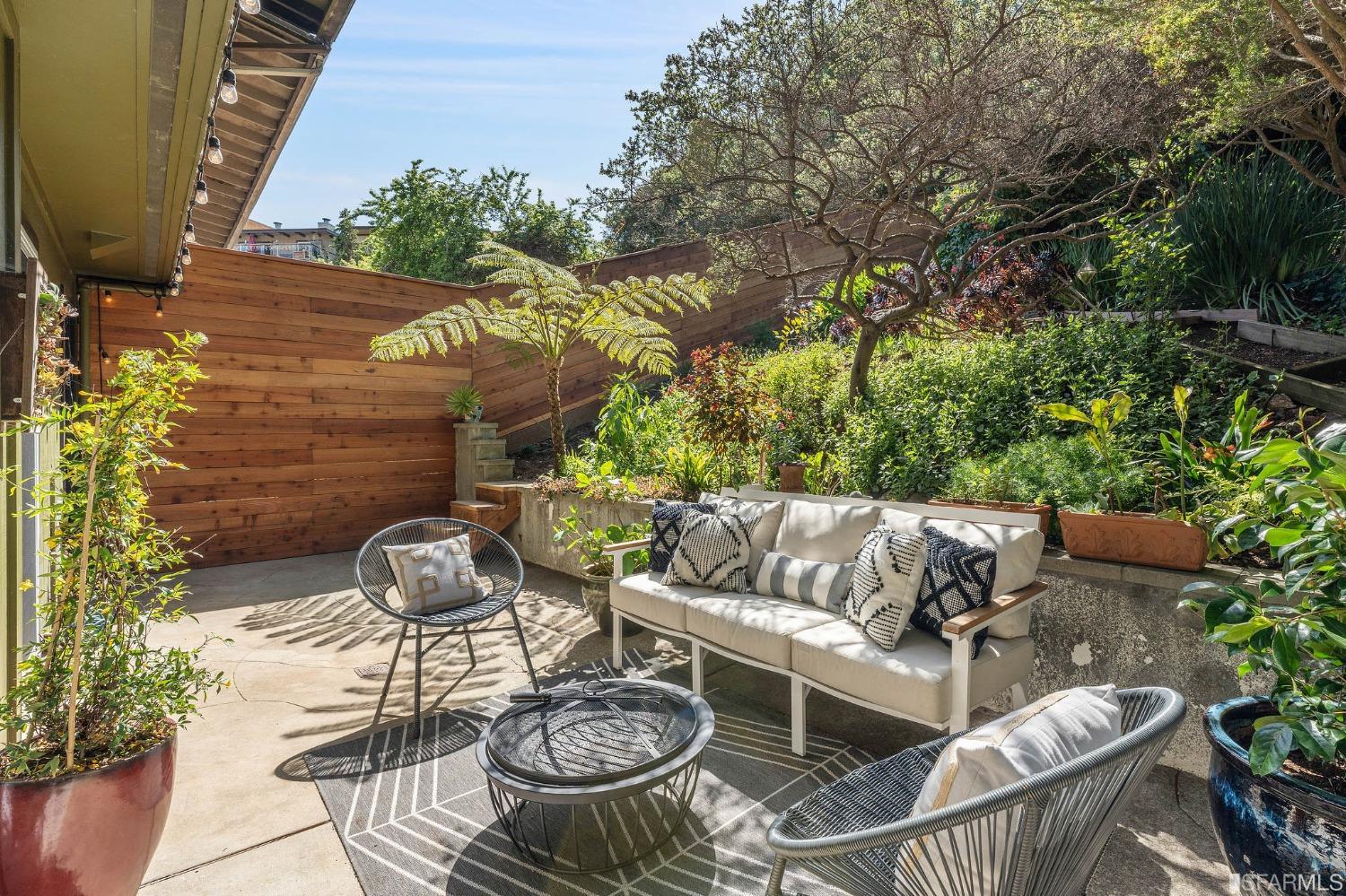 47 Malta Drive San Francisco, CA 94131 - Photo 18 of 40 a view of patio with couches table and chairs and potted plants