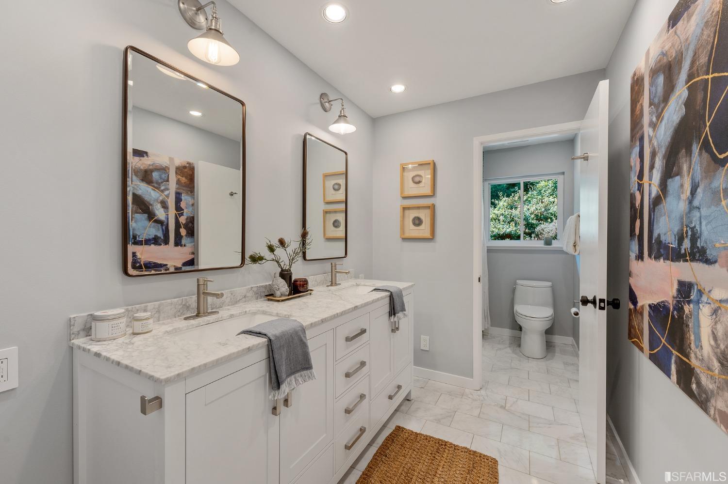 47 Malta Drive San Francisco, CA 94131 - Photo 28 of 40 a spacious bathroom with a granite countertop sink a toilet a shower and a mirror