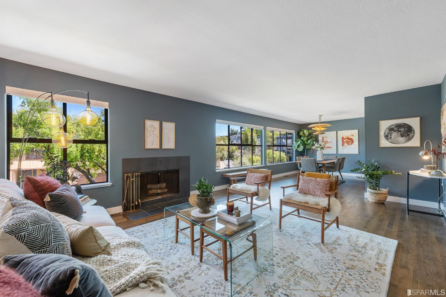 47 Malta Drive San Francisco, CA 94131 - Photo 5 of 40 a living room with furniture a fireplace and a large window