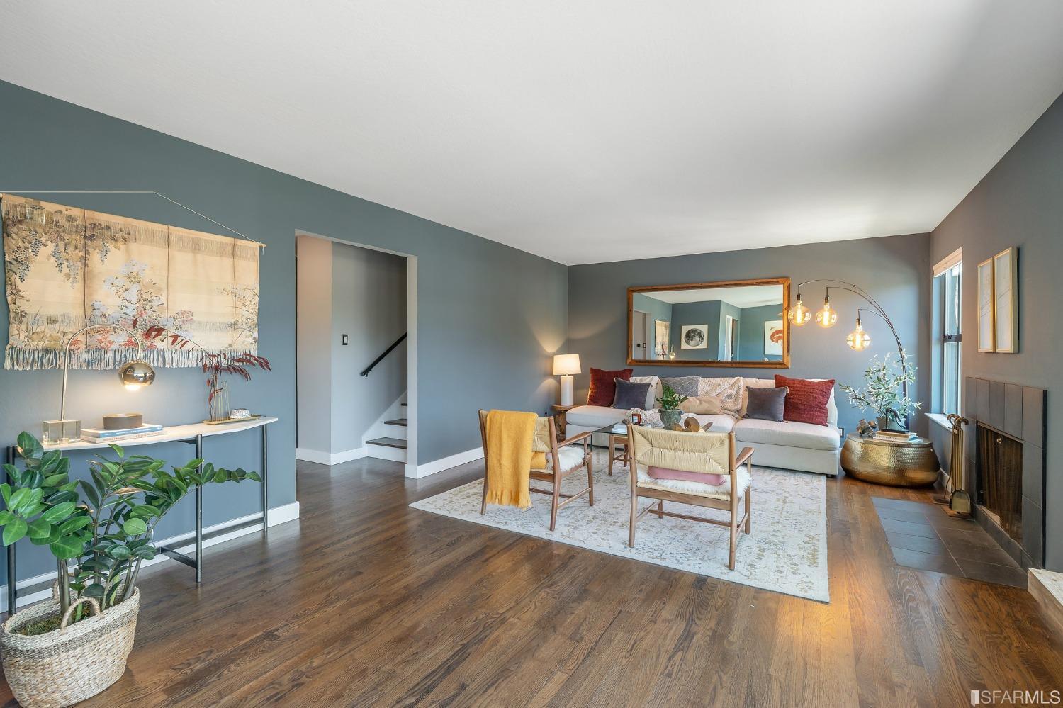 47 Malta Drive San Francisco, CA 94131 - Photo 7 of 40 a living room with furniture a potted plant and a large window