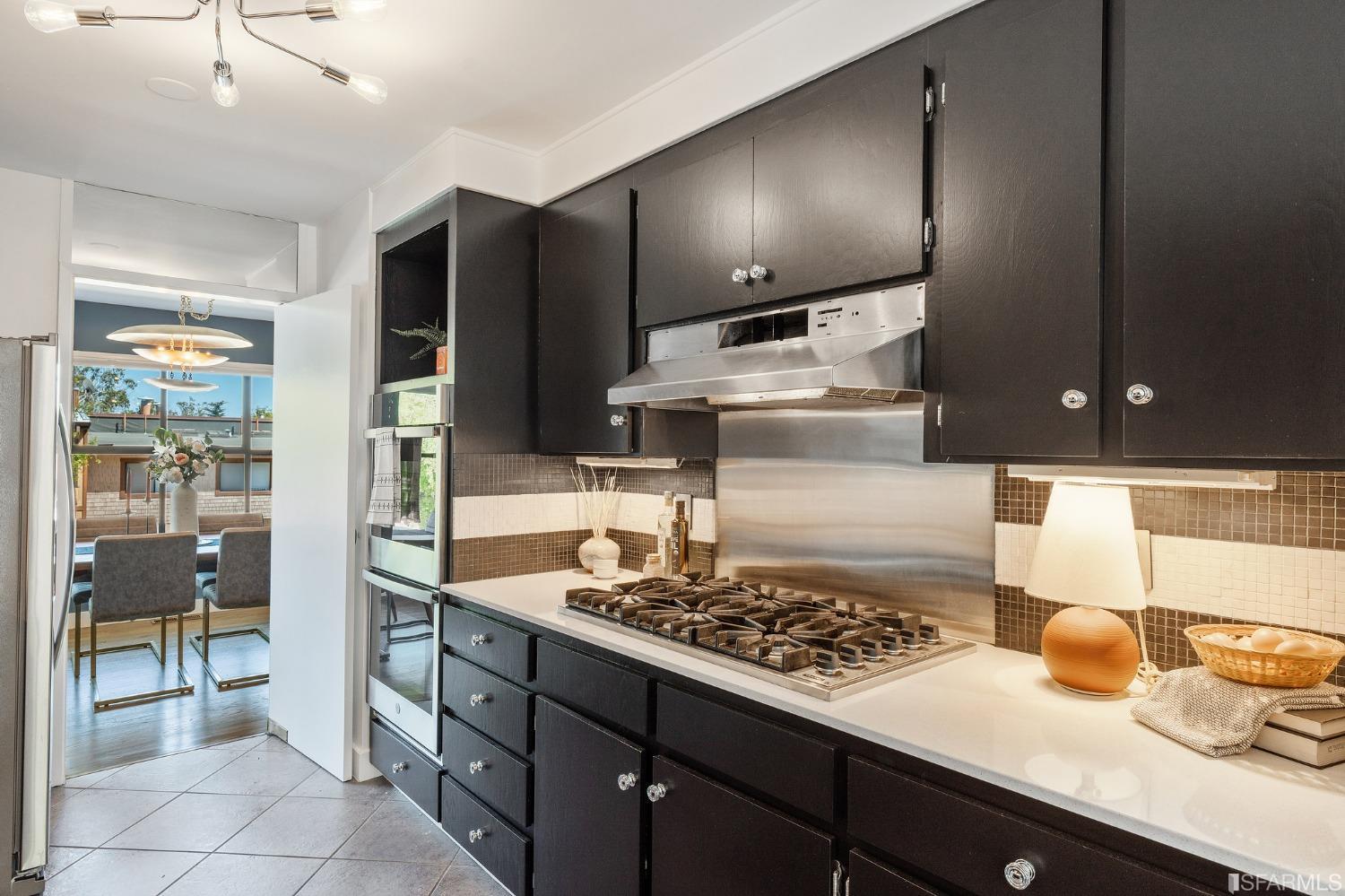47 Malta Drive San Francisco, CA 94131 - Photo 10 of 40 a kitchen with a sink stove and cabinets
