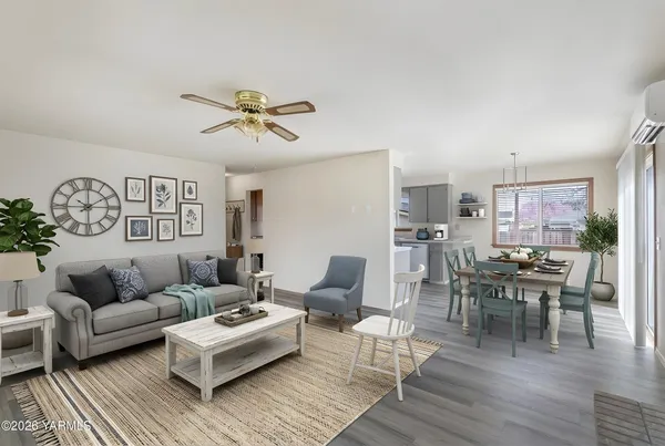 a living room with furniture a rug and a chandelier