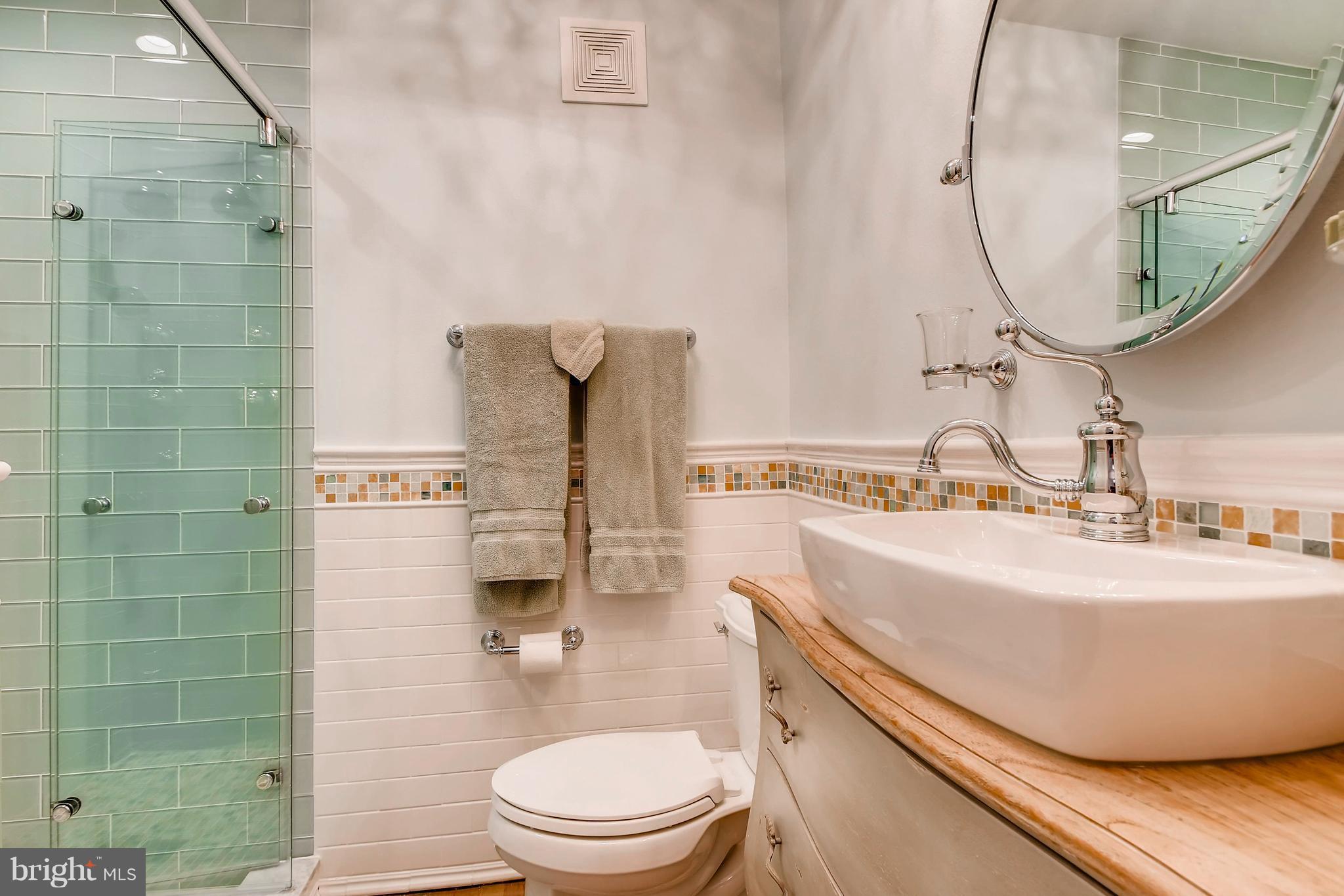 204 Witherspoon Road Baltimore, MD 21212 - Photo 17 of 30 a bathroom with a sink toilet and shower