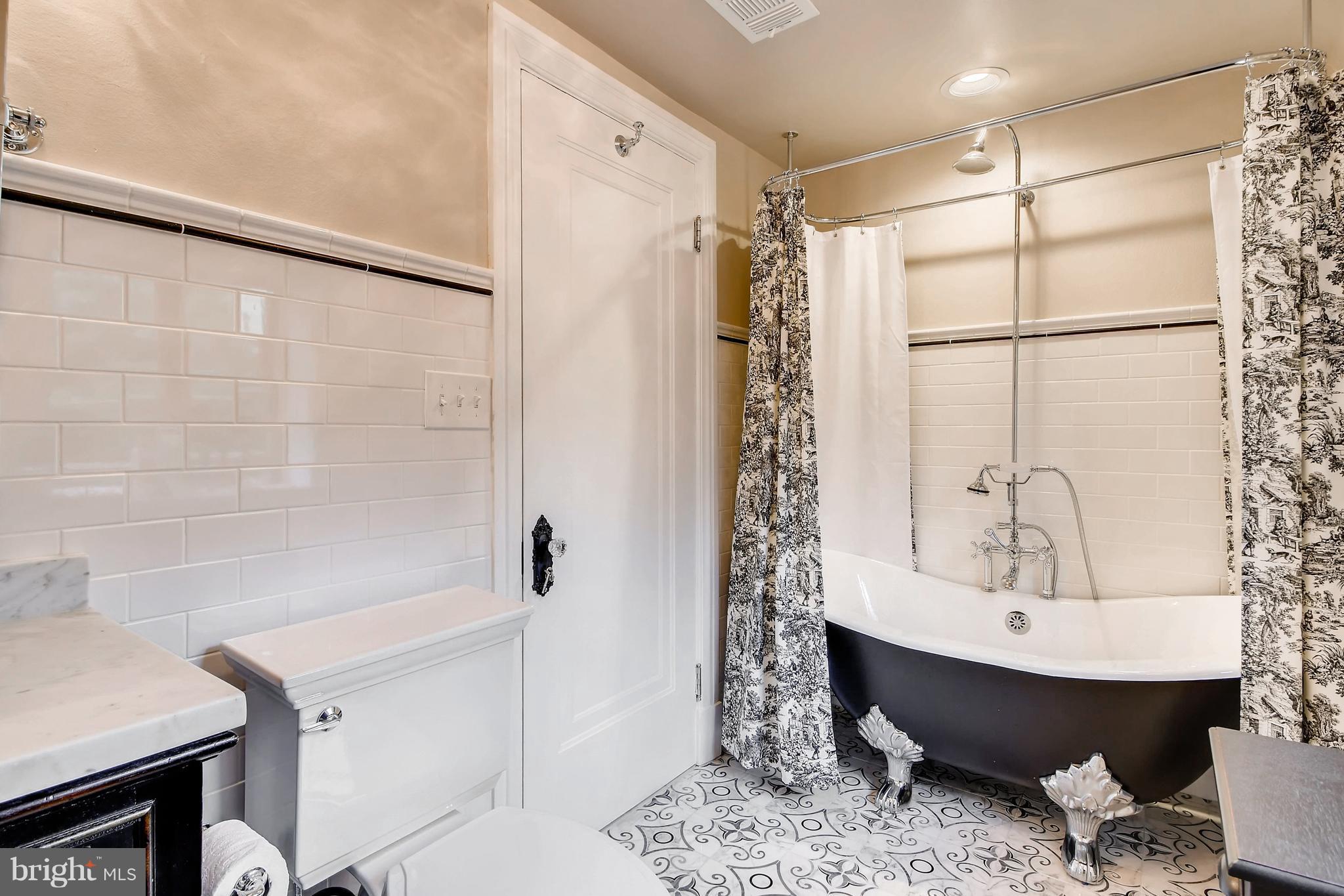 204 Witherspoon Road Baltimore, MD 21212 - Photo 23 of 30 a bathroom with a sink shower and a mirror