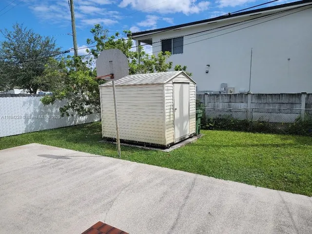 a view of a back yard of the house