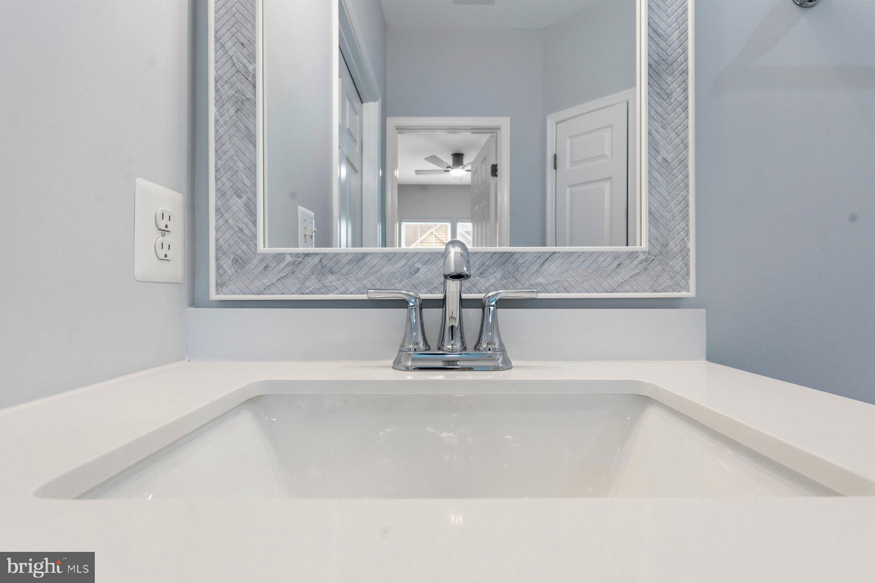 637 Wallingford Road, Unit 401 Bel Air, MD 21014 - Photo 25 of 28 Sleek modern sink with elegant mirror.