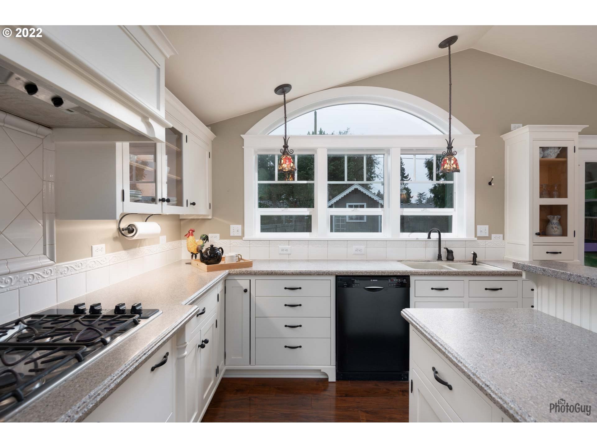 2027 Monterey Lane Eugene, OR 97401 - Photo 12 of 32 a kitchen with a sink stove and cabinets