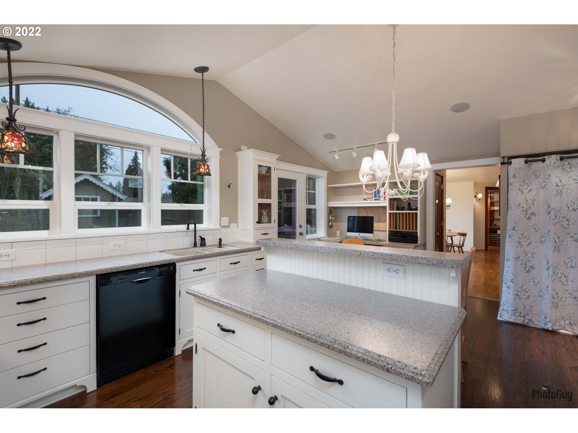 2027 Monterey Lane Eugene, OR 97401 - Photo 13 of 32 a large living room with a chandelier