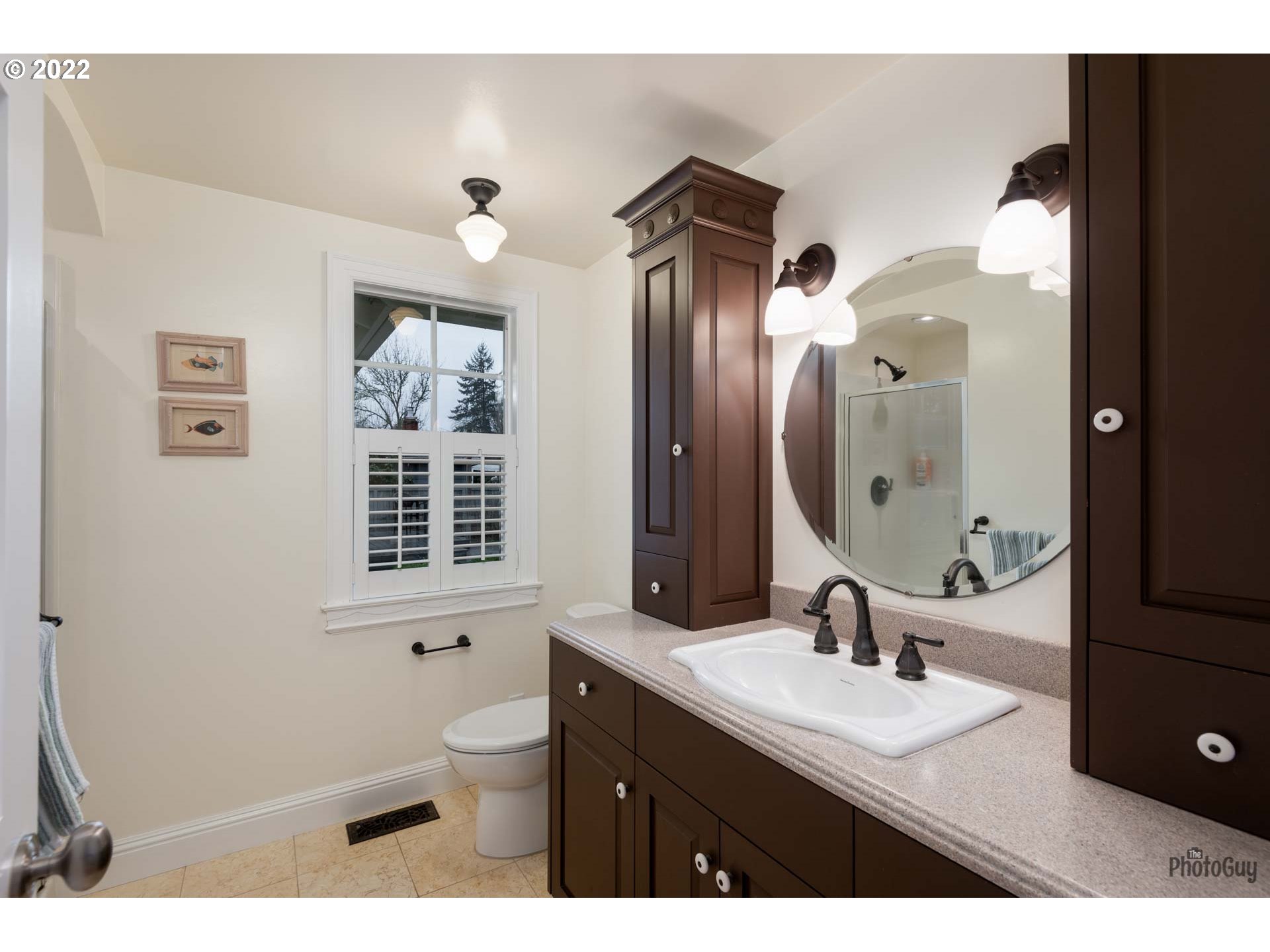 2027 Monterey Lane Eugene, OR 97401 - Photo 20 of 32 a bathroom with a granite countertop sink toilet a mirror and shower