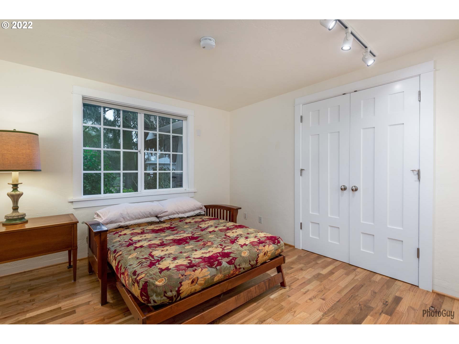 2027 Monterey Lane Eugene, OR 97401 - Photo 24 of 32 a bedroom with a bed and a window